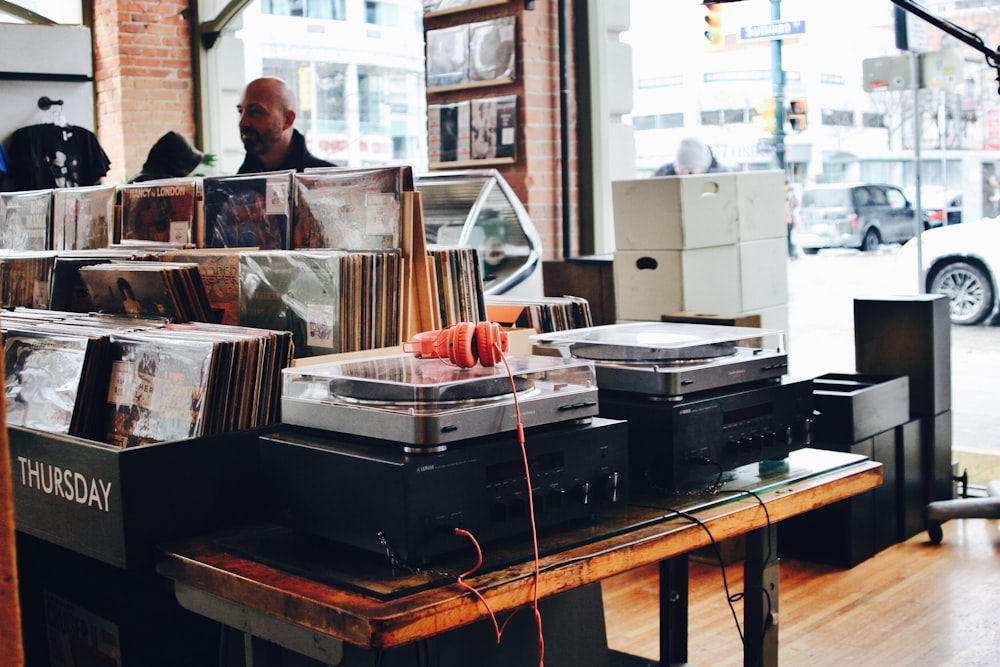 red headphones on gray turntable