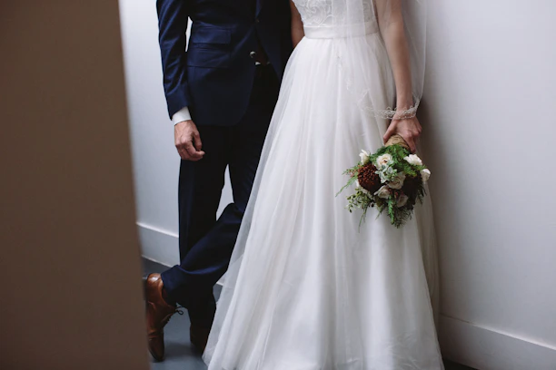 A minimalist wedding photo featuring soft natural light and clean lines.