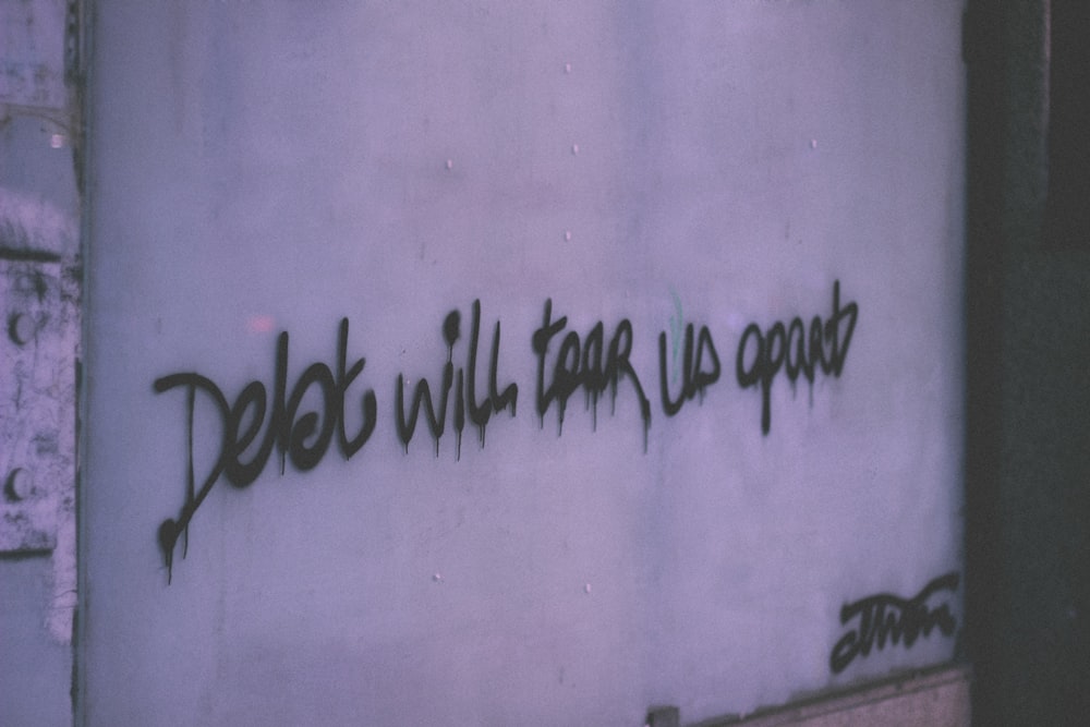 debt will tear us apart wall decor