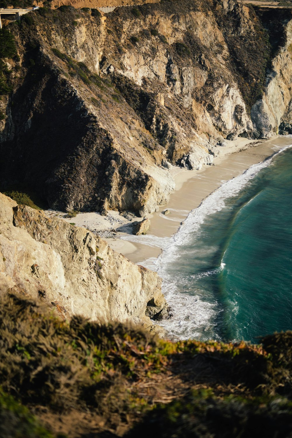 aerial photography of mountains and body of water