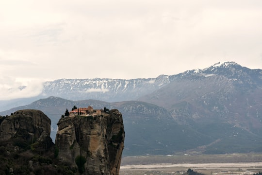 cliff taken under white clouds in Meteora Greece