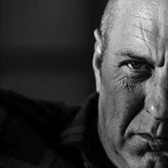 grayscale photo of man's face