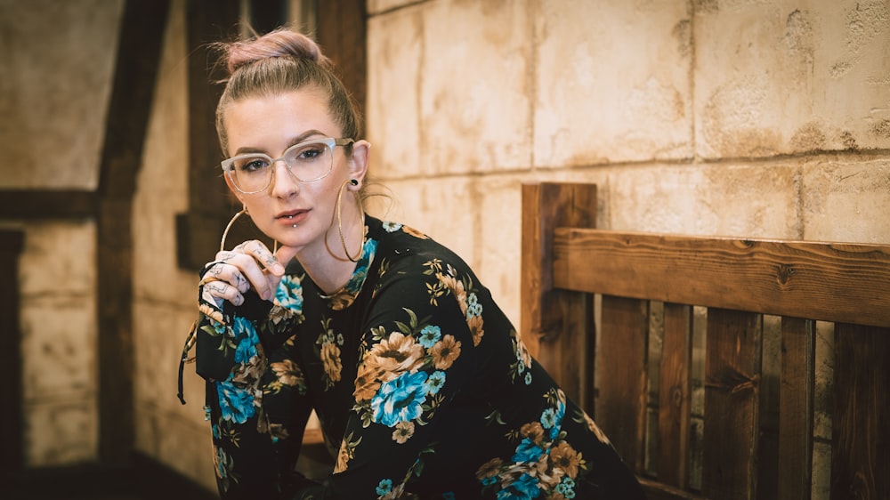 woman sitting on wooden bench