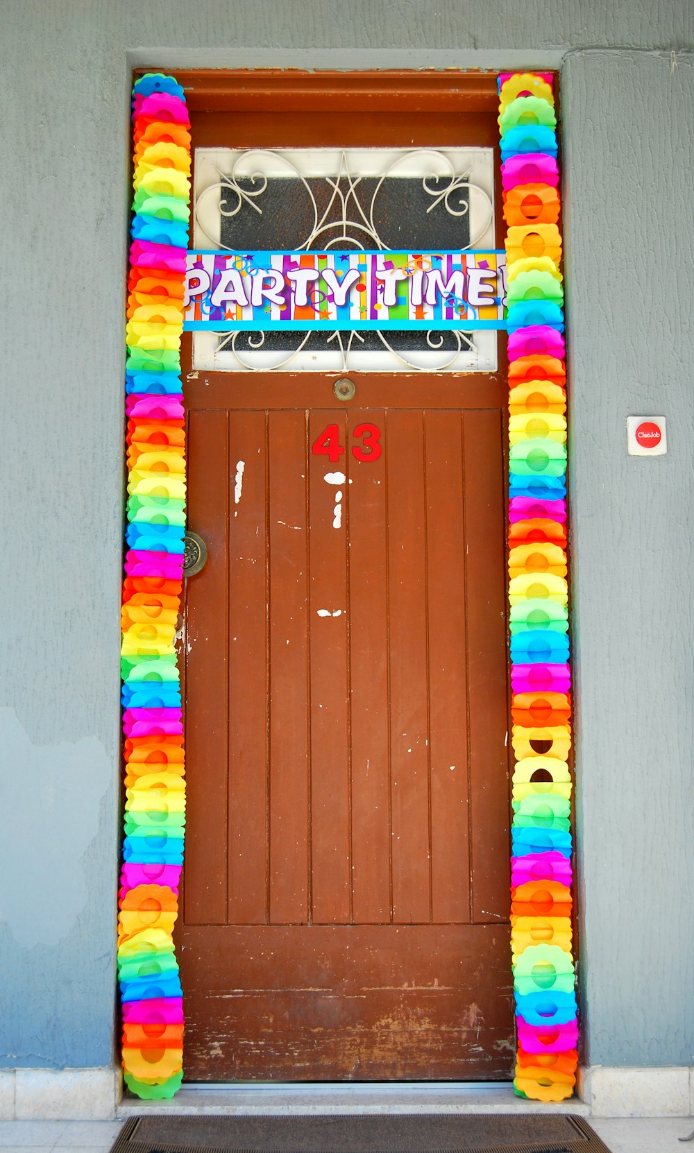 white and blue party time signage hanged on door