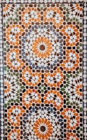 closeup photo of white, orange, and gray area rug