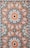 closeup photo of white, orange, and gray area rug