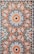 closeup photo of white, orange, and gray area rug