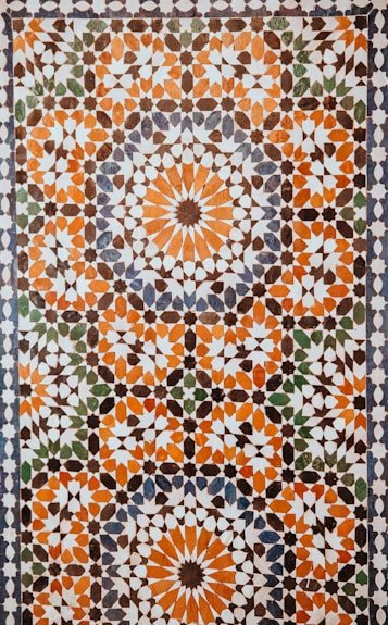 closeup photo of white, orange, and gray area rug