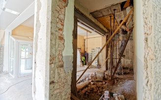 man climbing on ladder inside room