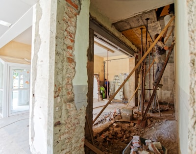 man climbing on ladder inside room