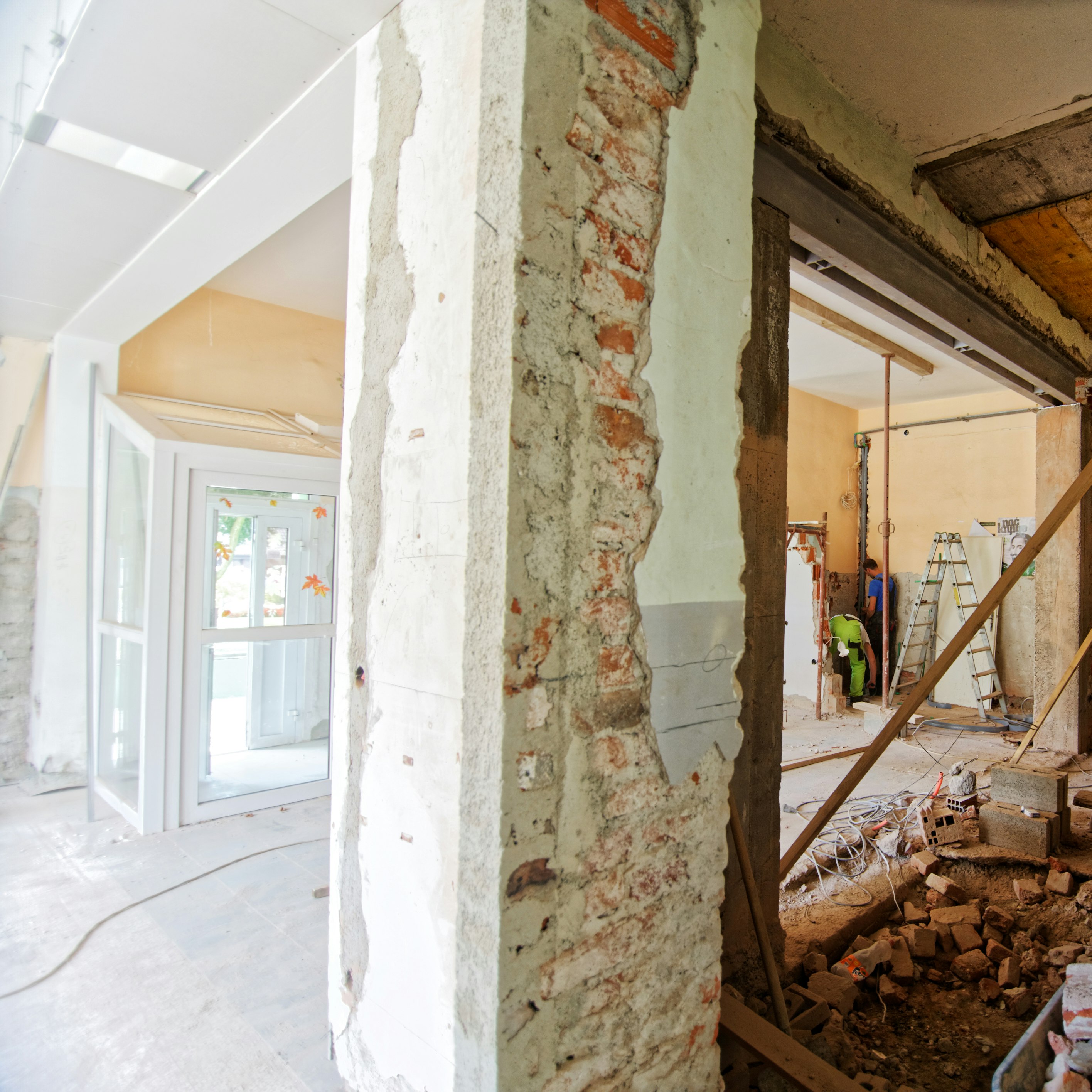 man climbing on ladder inside room