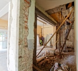 man climbing on ladder inside room