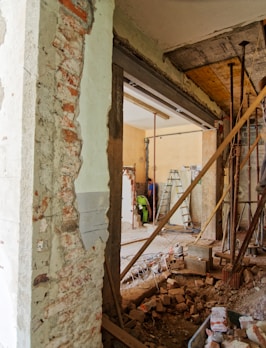 man climbing on ladder inside room