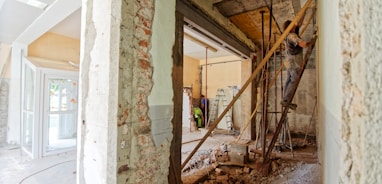 man climbing on ladder inside room