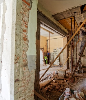 man climbing on ladder inside room