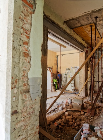 man climbing on ladder inside room