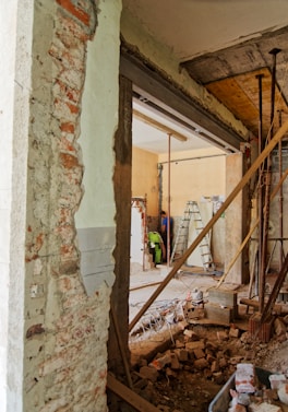 man climbing on ladder inside room