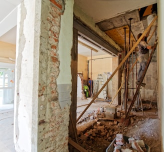 man climbing on ladder inside room