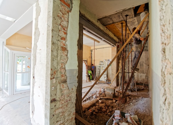 man climbing on ladder inside room