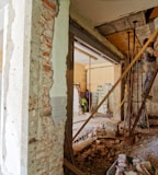 man climbing on ladder inside room