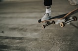 person jumping with skateboard