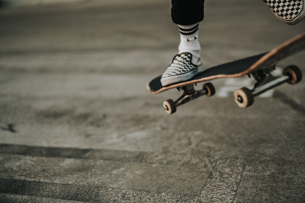 person jumping with skateboard