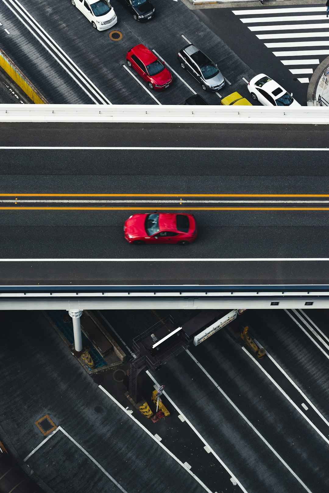 red car on super highway aerial photography