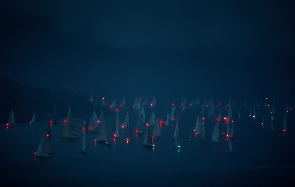 boats on body of water during night