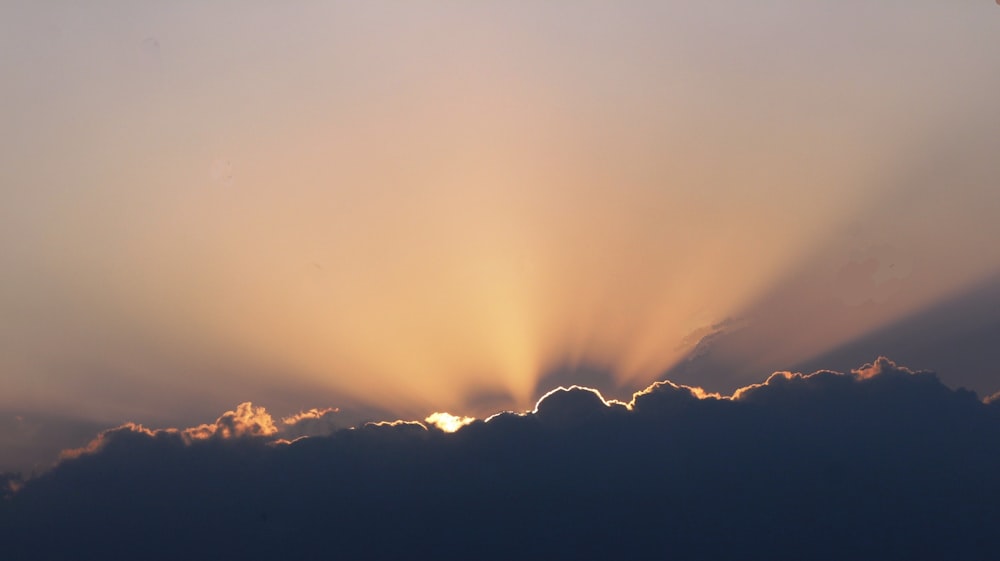 sunlight across black clouds