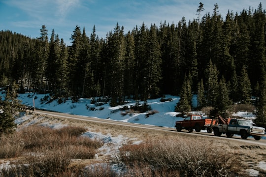 green single cab towing orange single cab in Breckenridge United States