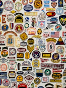 Colorful embroidered patches arranged neatly on a display board.