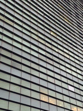 Facade of a commercial building with glass windows.