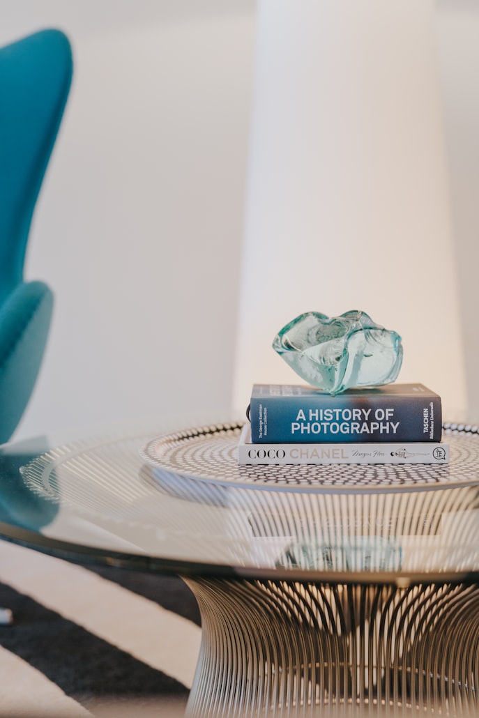 books on table photo by Mark Adriane via unsplash.com - Wood and glass coffee table ideas