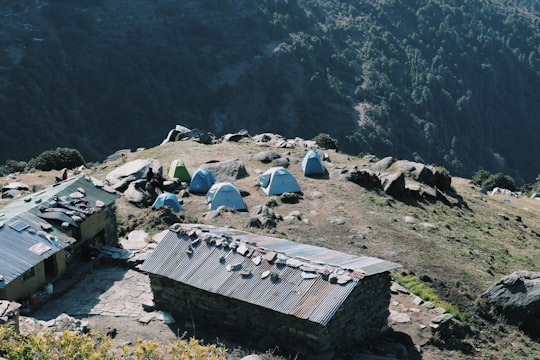 houses on mountain peak in Triund India