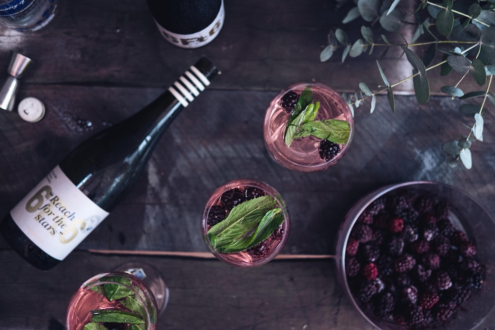 flat lay photography of bottle and bowls