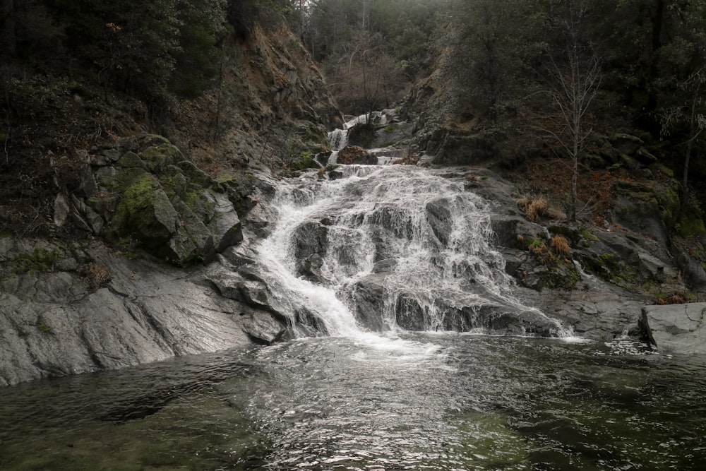 mountain waterfalls during daytime