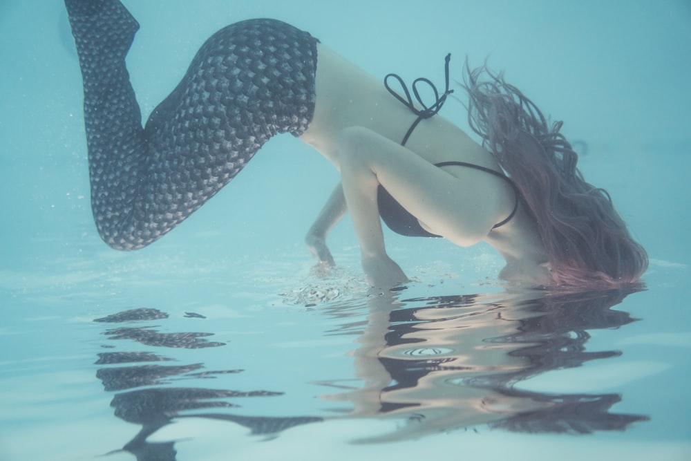 woman swimming underwater