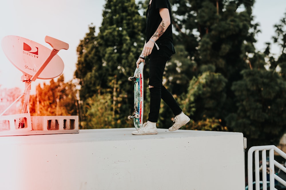 man holding skateboard