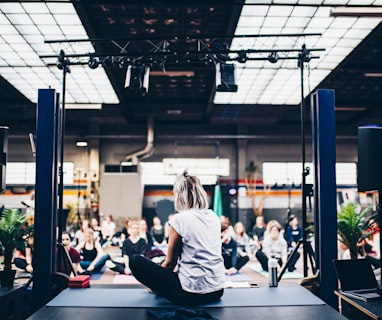 woman sitting in the yoga mat