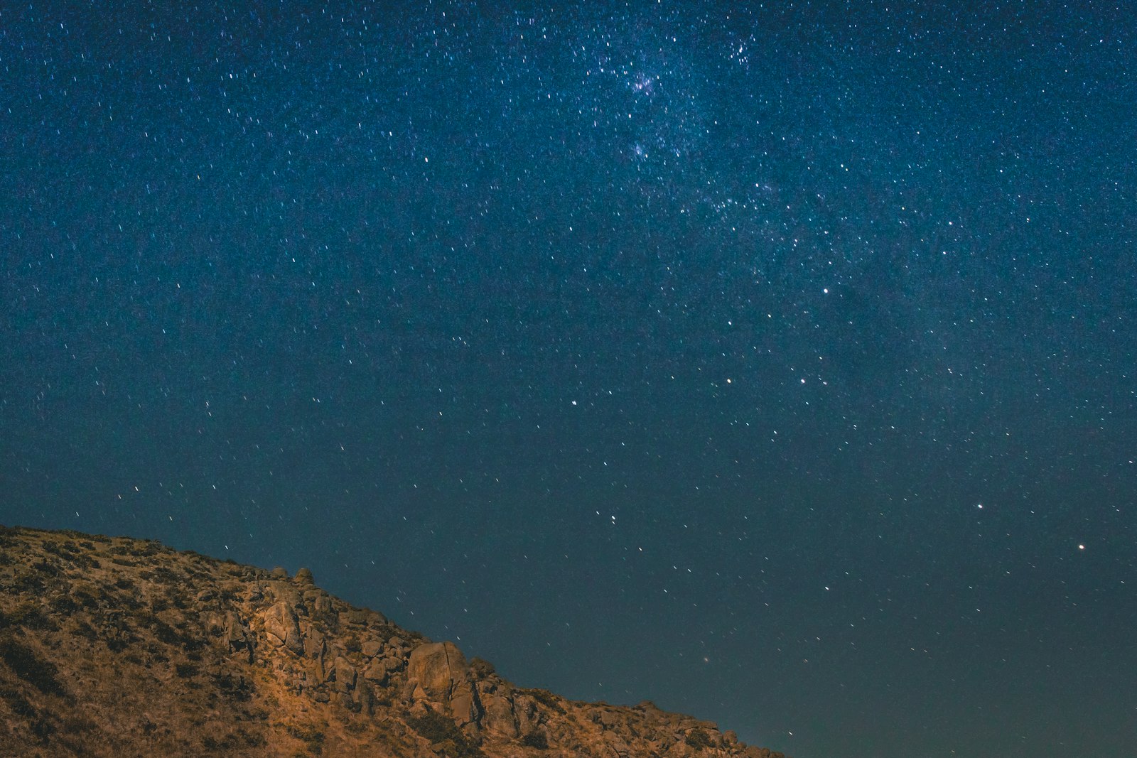 Canon EOS 7D Mark II + Canon EF-S 24mm F2.8 STM sample photo. Brown mountain under blue photography