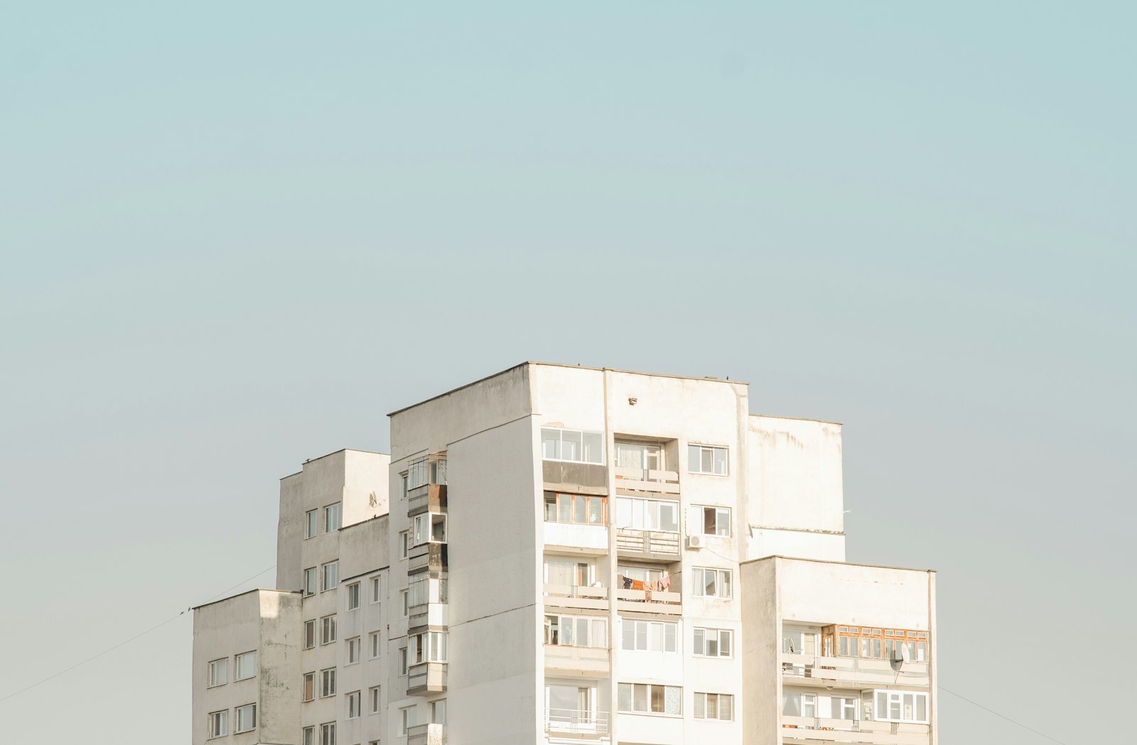 Nikon D7000 + Sigma 85mm F1.4 EX DG HSM sample photo. White concrete building during photography