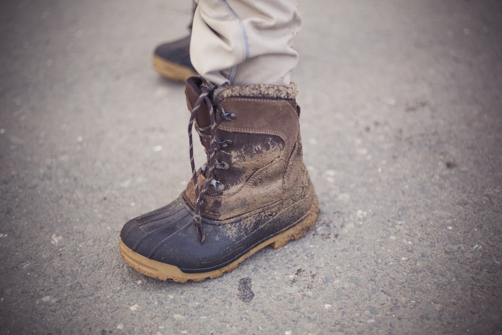 person wearing brown boot