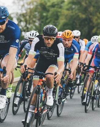 group of cyclist on asphalt road