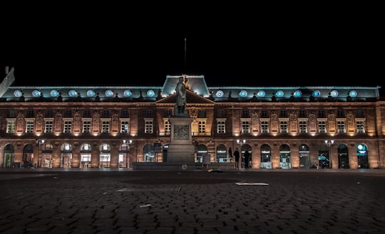 landscape photo of building during nighttime in Kléber square France