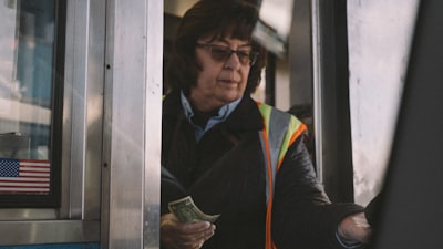 woman holding banknote vermont teams background