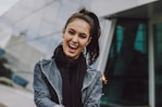 woman wearing gray denim jacket and black scarf