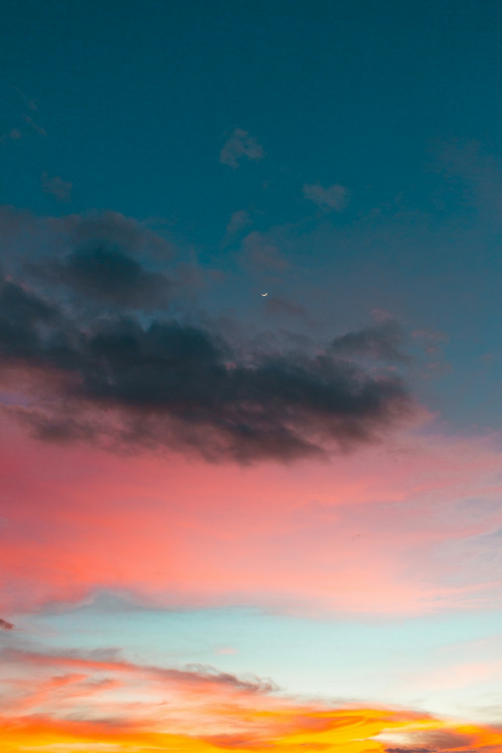 moon near gray and blue sky