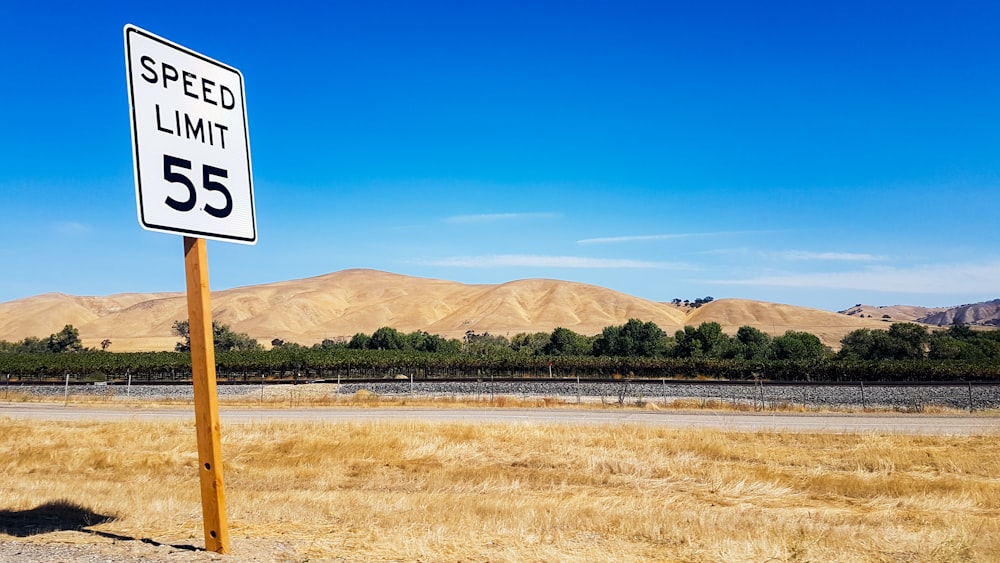 Speed Limit 55 signage on road