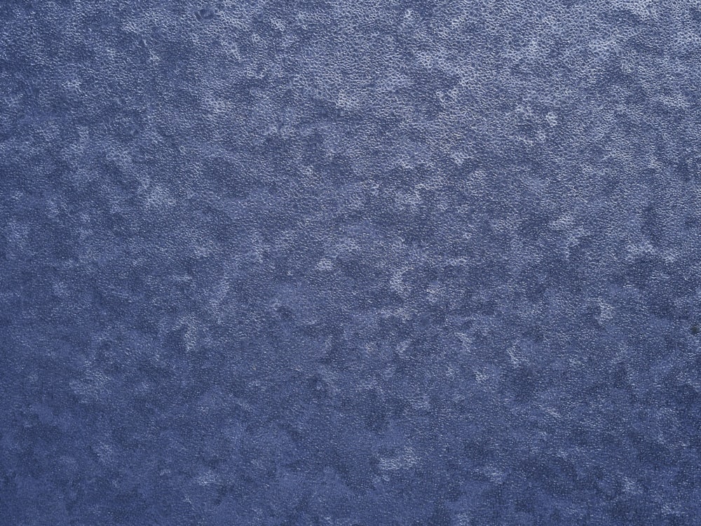 a close up of a blue wallpaper texture