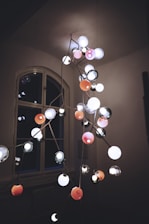 A modern chandelier installation in a home.